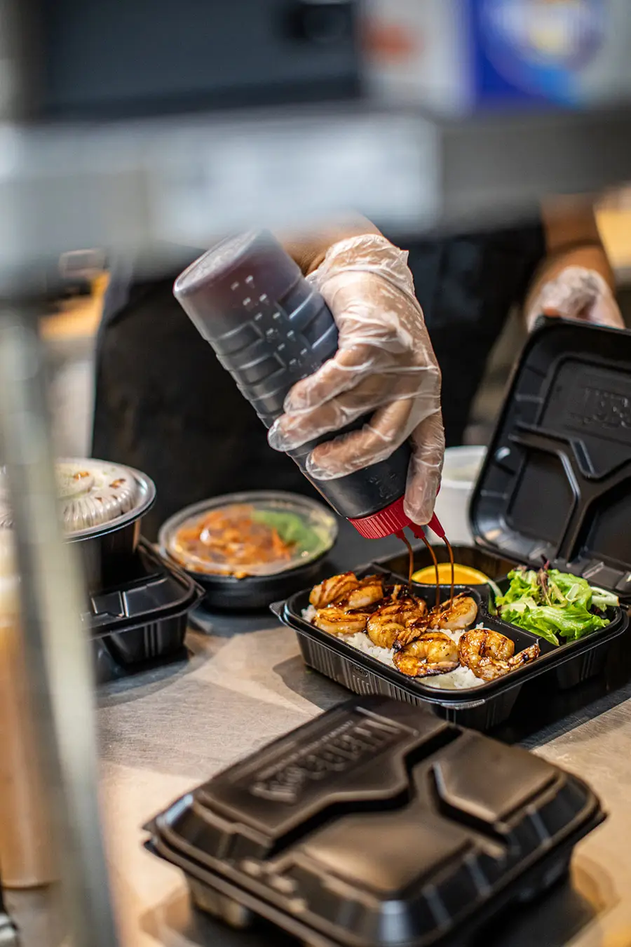 Hands preparing a fresh meal over open heat